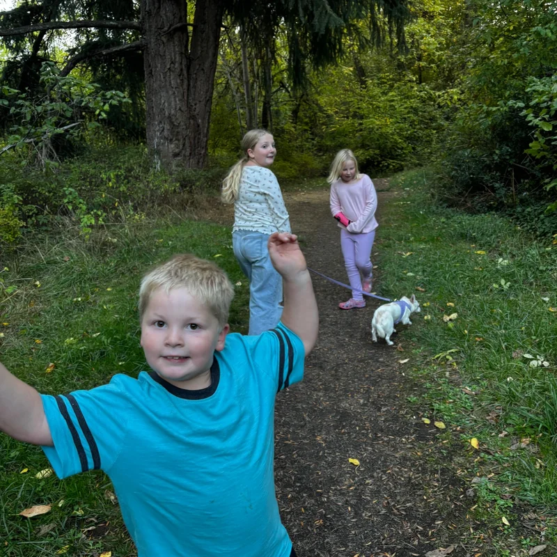 Children walking on a wooded trail together
